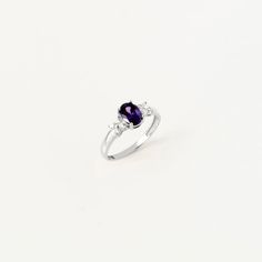 This exquisite ring whispers tales of twilight with its enchanting design and serene aura. Handcrafted with meticulous attention to detail, it exudes an air of elegance that speaks volumes of sophistication and style. Adorned with an oval-cut amethyst birthstone and complemented by CZ accents, this ring captures the essence of February birthdays. The amethyst, a symbol of serenity and spirituality, adds a touch of mystique and allure to the piece, making it a perfect gift for those born in this Elegant Amethyst Birthstone Ring For Promise, Elegant Amethyst Birthstone Ring With Prong Setting, Timeless Amethyst Ring As A Gift, Elegant Purple Birthstone Ring With Gemstone Accents, Elegant Promise Birthstone Ring With Gemstone Accents, Elegant Amethyst Ring With Gemstone Accents For Promise, Elegant Amethyst Promise Ring With Accent Stones, Classic Amethyst Birthstone Promise Ring, Elegant Amethyst Birthstone Ring In Cubic Zirconia