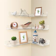 there are three shelves that have various items on them and one shelf has an animal figurine