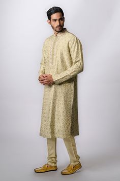 Olive kurta with floral print, zardozi embroidery and front buttons. Paired with churidar.
Component: 2
Pattern: Embroidered,Printed
Type Of Work: Floral
Neckline: Mandarin
Sleeve Type: Long Sleeves
Fabric: Tussar
Color: Green
Other Details: 
Front buttons
Zardozi work
Occasion: Puja, Wedding - Aza Fashions Semi-stitched Gold Kurta With Naqshi, Bollywood Style Kurta With Resham Embroidery For Reception, Eid Reception Traditional Wear With Gota Work, Designer Straight Kurta With Dabka Work, Bollywood Style Raw Silk Kurta For Reception, Festive Semi-stitched Kurta For Reception, Bollywood Style Straight Kurta For Reception, Raw Silk Kurta With Zari Work For Reception, Raw Silk Straight Kurta With Dabka