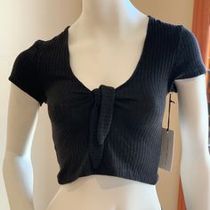 Nwt. Never Worn. Multiple Sizes Available. Soft, Ribbed Top Featuring Low Cut Neckline With Tie Knot Accent. Brand: Cotton Candy La Fiber Content: 95 % Polyester, 5% Spandex Casual Black Knit Crop Top, Casual Knit Crop Top For Night Out, Knot Crop Top, Ribbed Top, Tie Knots, Low Cut, Crop Top, Cotton Candy, Crop Tops