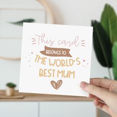 someone holding up a card that says, this card belongs to the world's best mum