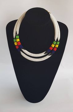 100% handcrafted using fine beads. The 2 strands are joined together to make one piece. Measurements; 19 inches for the long strand and 18 inches for the short one. **Buy multiple items and pay shipping for 1 item only.The rest ships free. More neckleces here; https://www.etsy.com/shop/TribalTess?ref=seller-platform-mcnav&section_id=21306083 Back to my shop; https://www.etsy.com/shop/TribalTess?ref=seller-platform-mcnav Handmade White Double Strand Beaded Necklaces, Handmade White Double Strand Beaded Necklace, White Double Strand Beaded Necklace, White Double Strand Necklace With Colorful Beads, White Double Strand Beaded Necklace With Colorful Beads, 2 In 1 Necklace, African Wedding Jewelry, African Necklace, Handmade African