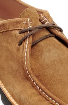 A lightweight lug sole serves as a study base for this low-profile suede chukka boasting a robust moc toe and cushioned footbed. Lace-up style Cushioned footbed with arch support Leather upper and lining/synthetic sole Imported Classic Low-top Suede Chukka Boots, Casual Suede Moccasins With Vibram Sole, Classic Suede Chukka Boots With Vibram Sole, Suede Low-top Chukka Boots With Rubber Sole, Low-top Suede Chukka Boots With Rubber Sole, Casual Chukka Boots With Moc Toe And Suede Lining, Suede Desert Boots With Goodyear Welt And Moc Toe, Casual Moccasins With Goodyear Welt Construction, Suede Chukka Boots With Vibram Sole