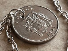 a close up of a coin on a chain