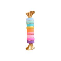 a multicolored vase sitting on top of a wooden stand