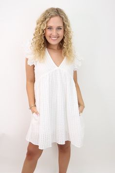 Indulge in effortless and elegant style with our white ruffled sleeve dress! This babydoll style dress features delicate ruffle sleeves, a flattering v-neckline, and a flowy fit for a comfortable and chic look. Made with a lightweight and textured fabric, it's the perfect dress for any occasion. Great for grads, brides, showers and more! White babydoll ruffle sleeve dress V-neckline Ruffle sleeves Babydoll style Flowy fit Lightweight textured fabric Keyhole back with button closure Lined Katie i Ruffled Sleeve Dress, White Babydoll, Babydoll Style Dress, Babydoll Style, Ruffle Sleeve Dress, Babydoll Dress, Shop Swimwear, Elegant Style, Perfect Dress