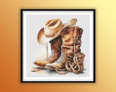 a cross stitch picture of two cowboy boots and a hat