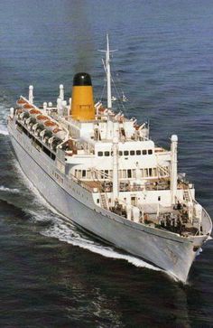 a large white ship in the middle of the ocean