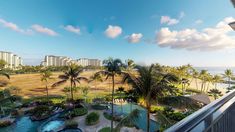 the view from an oceanfront balcony looking out at palm trees