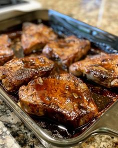 some meat is sitting in a pan on the counter