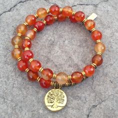 Faceted Carnelian, Sacral Chakra, Mala Bracelet Made with genuine carnelian. Brass hand made beads support women in Africa. Contains 27 beads so its a wrist mala! Stringed on our signature, exclusive thick hitec elastic. Made in the USA. Carnelian: A stabilizing stone, Carnelian restores vitality and motivation, and stimulates creativity. It gives courage, promotes positive life choices, dispels apathy and motivates for success. Memory Wire Jewelry, Beaded Memory Wire Bracelets, Beaded Memory Wire, Wrist Mala, Carnelian Jewelry, African Trade Beads, Beads Bracelet Design, Detailed Jewelry, Chakra Jewelry