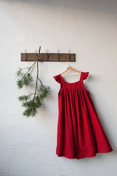 Victorian style inspired pinafore dress with flutter sleeve made from 100% soft and washed Oeko-Tex certified linen Details: - Composition: 100% Oeko-Tex certified linen - Colour: red - Coconut buttons down the back - Size: XS-S, M, L-XL - Medium weight linen - Linen care: machine wash gentle; tumble dry low, ironing optional - The price is for one pinafore dress, other pictured items are not included Relaxed Fit Linen Dress With Ruffles, Relaxed Fit Linen Ruffle Dress, Dress With Wings, Dress With Flutter Sleeves, Dress Linen, Prairie Dress, Pinafore Dress, Comfortable Tops, Linen Apron