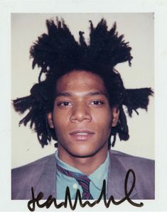 an autographed photograph of a young man with dreadlocks on his head