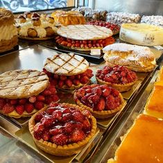 many different types of pies and pastries on display