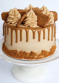 there is a cake with cookies and cream frosting on the top, sitting on a plate