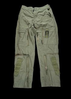 These are Vintage 1980s Military issued Cargo pants, Tons of pockets and details these are super unique and will complement any outfit! Faded Sun Burned Olive and Non Faded Available!..  Product Photos are the non faded pair.. Photos on Model are the Sun burned faded olive Pair! Please Let us know your preference before ordering! 🤟🏼 1980s Tactical Military Trousers Size / All sizes Available  Color: Vintage Olive  Please note all items are examined to the best of our ability. Most items are 20+ years old and are not in perfect condition small imperfections are to be expected any major flaws will be disclosed.  No major flaws Condition:9/10 MESSAGE WITH OFFERS AND QUESTIONS  NO RETURNS  FOLLOW OUR PAGE FOR DAILY HEAT NEW ITEMS DROP DAILY! Gorpcore Trousers, Military Style Pants With Multiple Pockets, Military Pants With Multiple Pockets, Combat Pants With Patch Pockets For Streetwear, Military Style Full-length Parachute Pants With Multiple Pockets, Military Full-length Parachute Pants With Multiple Pockets, Retro Cargo Pocket Bottoms For Streetwear, Retro Streetwear Bottoms With Cargo Pockets, Retro Cargo Pants With Cargo Pockets For Streetwear