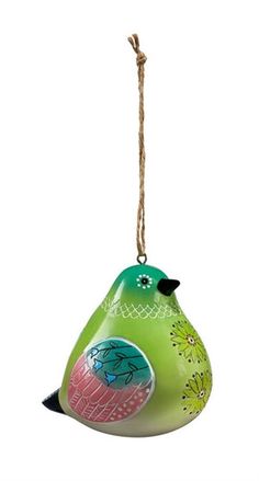 a green bird ornament hanging from a rope