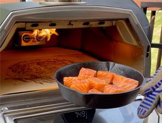 salmon being cooked in an oven on the grill