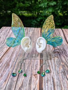 These unique cuffs are perfect for forest fae! Made with an ear cuff that hugs the shell of your ear and sparkling holographic vinyl, and accented with glittering gems. They're great for fantasy photography, Halloween, or ren faire. The listing is for the pair of left and right ear cuffs. Flat rate shipping on all my items!