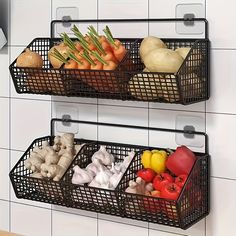 two metal baskets filled with vegetables on top of a tiled kitchen wall next to a sink