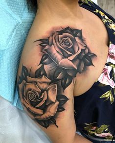 black and white rose tattoo on the shoulder