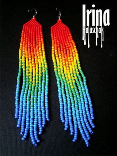 two pairs of multicolored beaded earrings with long fringes on black background