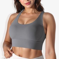 The Anna-Kaci Women's Scoop Neck Stretchy Cropped Banded Cup Seam Sports Bra is a stylish and functional addition to your activewear collection. This athletic top features a scoop neckline and a cropped design, providing a modern and sleek look. The banded cup seams and double-layering offer excellent support and a flattering fit. Made from 4-way stretch fabric, this sports bra ensures maximum flexibility and comfort during any workout. The padded cups add extra support and comfort, making it pe Gray High Stretch Casual Sports Bra, Casual Gray Breathable Sports Bra, Gray Casual Breathable Sports Bra, Gray Moisture-wicking Casual Sports Bra, Breathable Scoop Neck Sports Bra For Light Exercise, Gray Sweat-resistant Sports Bra For Light Sports, Gray Top With Built-in Bra And Medium Support, Gray High Stretch Tops For Light Exercise, Gray Seamless Sports Top