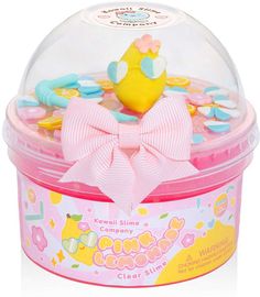 a small toy duck in a plastic container with gummy candies on the lid