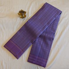 This Pastel Lavender Pure Silk Kanjeevaram saree features delicate Chakra Buttis, bringing a touch of traditional charm to any occasion. The twin borders add a subtle yet elegant finish, making it a must-have piece in any saree collection. Crafted from pure mulberry silk, this saree offers luxurious comfort and quality. Saree comes with attached running blouse. Pico + Fall service offered as an add-on. Approximate weight: 630 grams All of our saris are silk mark certified handloom saris, made us South Indian Sari, Saree South Indian, Pastel Lavender, Indian Sari, Silk Sari, Sari Silk, Lavender Fields, Summer Color, Summer Colors