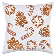 a white pillow with ginger cookies and candy canes printed on it's side