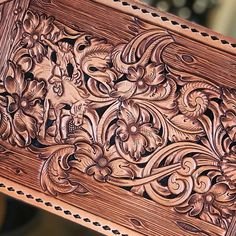 an intricately carved wooden box is shown