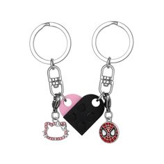 two different key chains with spiderman and pink heart shaped charms attached to each other