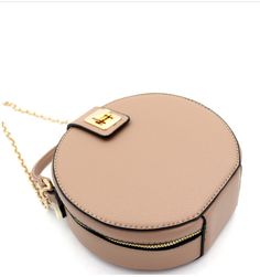 Dimensions - 7"L x 2.5"W x 7"H, 2.75"drop handle/ Adjustable shoulder strap/ Faux-leather material/ Gold-tone hardware/ Interior - 1 zip pocket/ Closure - zipper and flap with turn-lock/ Beige Crossbody Shoulder Bag With Zipper Closure, Beige Crossbody Shoulder Bag With Zipper, Beige Zipper Closure Crossbody Shoulder Bag, Taupe Leather Bag With Zipper Closure, Beige Crossbody Satchel With Zipper Pocket, Beige Satchel With Zipper Closure For Evening, Beige Evening Satchel With Zipper Closure, Chic Beige Satchel With Zipper Pocket, Evening Beige Satchel With Zipper Closure