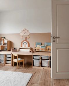 a child's playroom with toys and storage bins