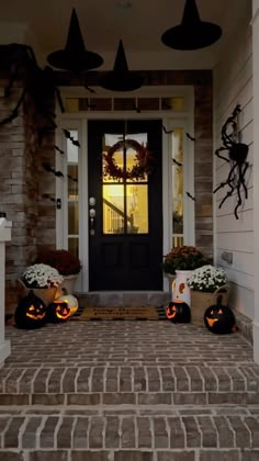 halloween decorations on the front steps of a house