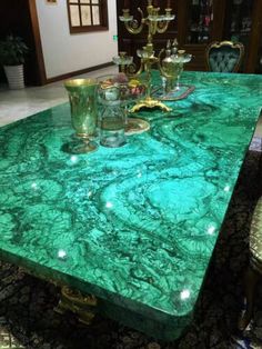 green marble dining table with gold accents