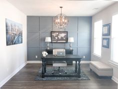 a living room with a couch, table and lamp in it's centerpiece