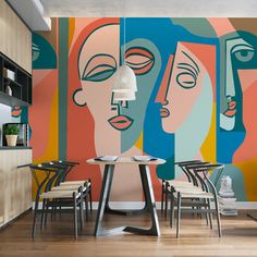 a colorful wall mural in a restaurant with tables and chairs