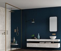 a bathroom with blue wallpaper and wooden flooring is pictured in this image, there are two sinks on the counter