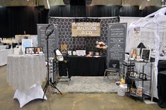 a photo booth set up with black and white decor