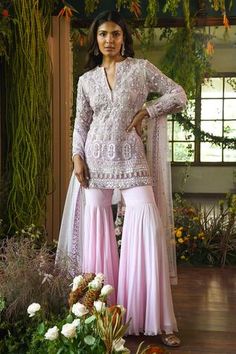 Pink short net kurta with mirror patra work, embellished bead-Swarovski and zardozi handwork. Comes with sharara pants and sheer dupatta.
Components:3
Embroidered
Neckline:Round
Sleeve Length:Long
Fabric:Net, Georgette
Color:Pink
Split neck
Side slits - Aza Fashions Lehenga Pink, Pink Sharara, Brocade Lehenga, Embroidered Sharara, Sharara Pants, Kurta Sharara Set, Net Embroidery, Kurta Sharara, Short Kurta