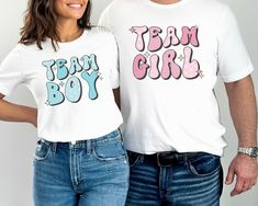 "💙 Get ready for the ultimate gender reveal celebration with our Retro Gender Reveal Shirt! This trendy T-shirt is perfect for the whole family and features \"Team Boy\" and \"Team Girl\" designs. Whether you're hosting a baby shower or want to add excitement to your gender reveal, our versatile and stylish Gender Reveal Group Shirt is a must-have. Grab yours now and let the anticipation begin! 👕 PRODUCT INFO The Bella + Canvas shirts are super soft and comfy! These t-shirts are made of light fabric and have ribbed knit collars to bolster shaping. They are extremely durable, and will withstand years of repeat washing and wearing. Shoulders, sleeves, and hems have taping for better fit over time. ✏️ DESIGN Designs are printed onto the shirt using Direct to Garment (DTG), which means the i Gender Reveal Shirt Ideas For Parents, Gender Reveal Shirts For Parents, He Or She Gender Reveal, Gender Reveal Outfit, Keeper Of The Gender, Gender Reveal Shirts, Pregnancy Announcements, Group Shirts, He Or She