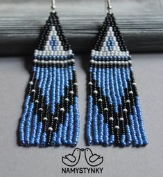 blue and black seed beaded earrings with bird on the side, hanging from hooks