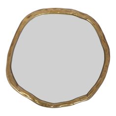 an oval mirror made out of gold leaf