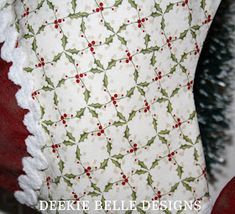 a close up of a christmas pillow on a chair