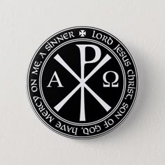 a black and white button with the letter p in it's center on a white background