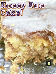 a close up of a piece of cake on a plate with the words honey bun cake