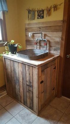 a sink made out of wooden planks in a bathroom with tile flooring and yellow walls