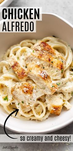 chicken alfredo with creamy and cheesy sauce in a white bowl