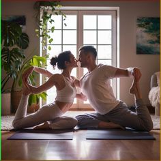 a man and woman are sitting on yoga mats